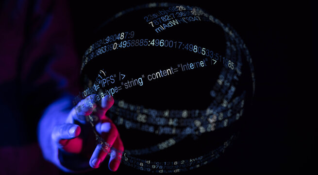 A conceptual image of a hand interacting with a digital sphere covered in code, representing internet, data, and future technology.