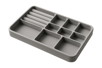 Multi-compartment plastic tray for organizing jewelry on a dresser.