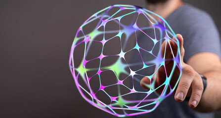 Close up shot of a man holding a colorful abstract digital sphere, representing the global network, concept of connection, technology