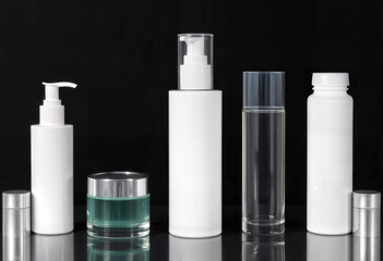 Assorted Cosmetic Bottles and Jars on Black Background