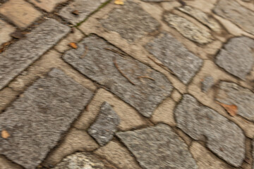 Blurred abstract pattern of ancient cobblestone pathway on kampa island in prague, creating a rough surface texture