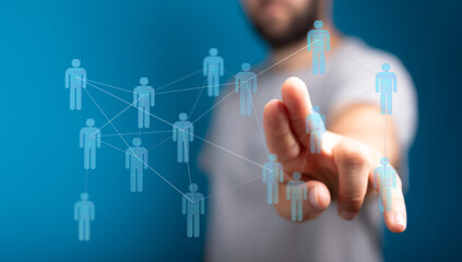Close-up of a hand interacting with a network of digital people icons, symbolizing connection, networking, and technology.