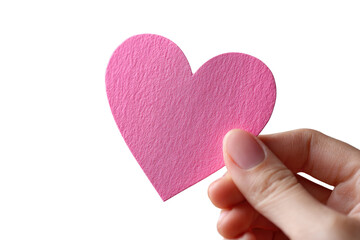 Obraz premium A pink heart-shaped paper cutout held gently by a hand