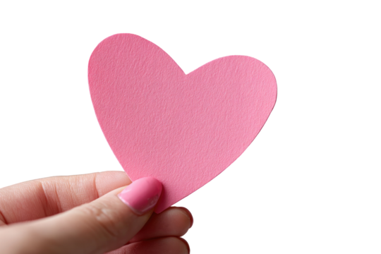 A pink heart-shaped cutout held by a hand