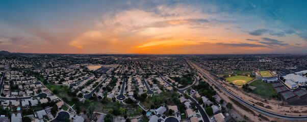 Aerial panoramic image ant dusk over a suburban Phoenix neighborhood. 