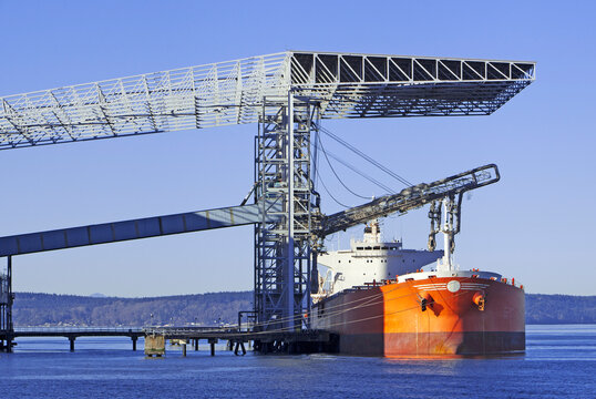 A grain container ship being loaded at the docks in Port of Tacoma. Washington State.