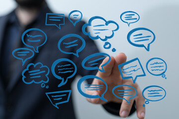 Man touching interactive speech bubble icons. Communication and digital interface concept.  Discussing and shar