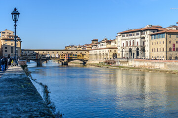 The Arno River and the Ponte Vecchio bridge across the water in the historic city of Florence. 