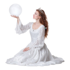 Young woman dressed as a princess in a white ball gown and tiara, sitting on the floor and holding a glowing spherical object in a fantasy fairytale