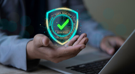 Businessman holding an ISO Certified hologram. Quality Assurance shield symbol showing 100% quality and verified assurance status.