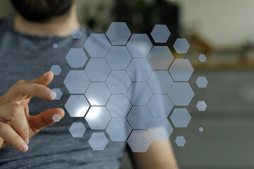 Hand touching digital hexagon interface, futuristic technology concept for innovation, data visualization, and
