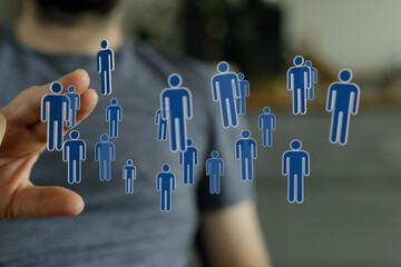 Hand holding digital people figures concept. Network connection, technology and teamwork, business,...