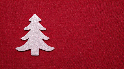 Simple white Christmas tree decoration with sparkle on festive red background. joyful holiday concept with copy space for celebration