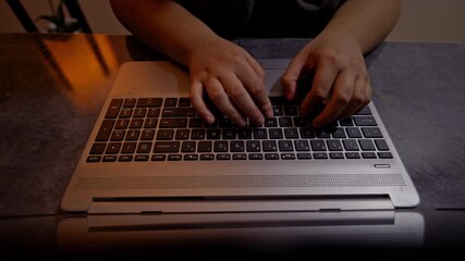Close-up of human hands rapidly typing on a laptop keyboard, illustrating concepts of modern work, digital communication, online learning, and focused productivity.