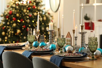 Festive table setting with Christmas decor at home