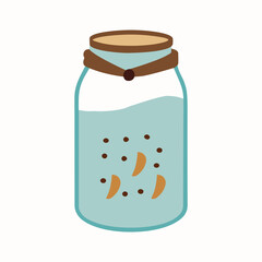 Glass jar filled with homemade cookies tied with rustic ribbon