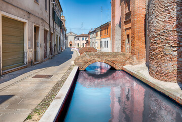 Walking among the picturesque canals of Comacchio, Italy