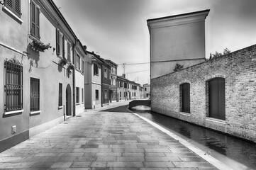 Walking among the picturesque canals of Comacchio, Italy