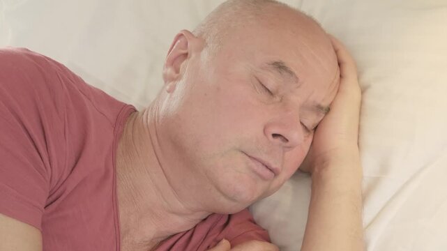 senior man rests deeply, eyes closed and face serene, Nighttime struggles, sleep disruption, anxiety in older adult, quiet moment true rest, reminding healing begins body finally surrenders to sleep