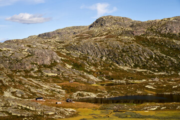  Scenic Small Wooden Cabins Amidst a Lake in Highland, Near Gaustatoppen, Norway's Majestic Mountain Landscape