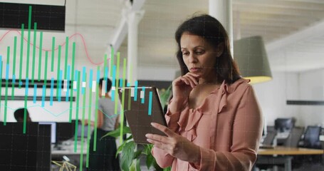 Manager tapping tablet and starting data bars flowing across business office, analyzing data