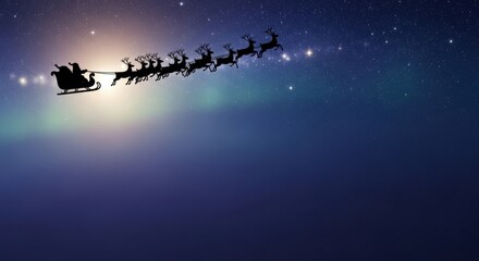 Silhouette of Santas sleigh and reindeer flying across a starry night sky. Festive Christmas holiday scene for greeting card background.