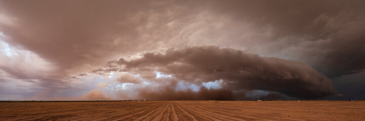 A supercell, a severe warning storm, a sky with dramatic dark clouds sitting on the horizon. 