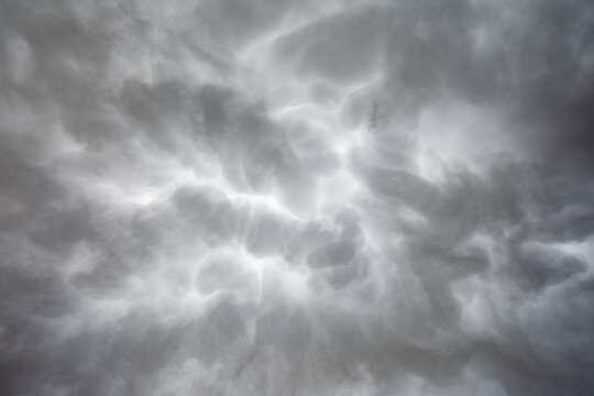 Mammatus Clouds in the sky, grey and white clouds shaped by weather. 