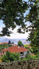 Summer Vista Overlooking a Mediterranean Village and Distant Lake