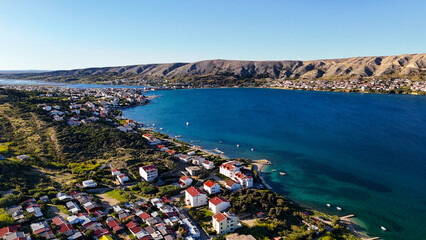 Aerial Drone View of Pag Island and the Coastal Town of Lun in Croatia. Stunning Adriatic Sea coastline, wild forests, rugged landscapes, and untouched Mediterranean nature captured from great height