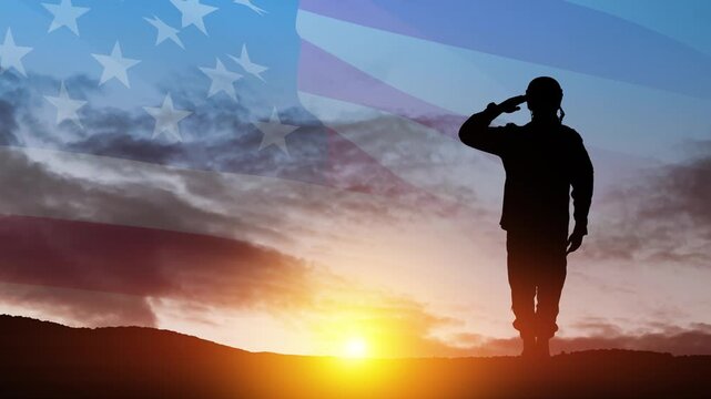Silhouette of soldier saluting on background of sunset or sunrise and USA flag. Veterans Day, Memorial Day, Independence Day. America celebration.