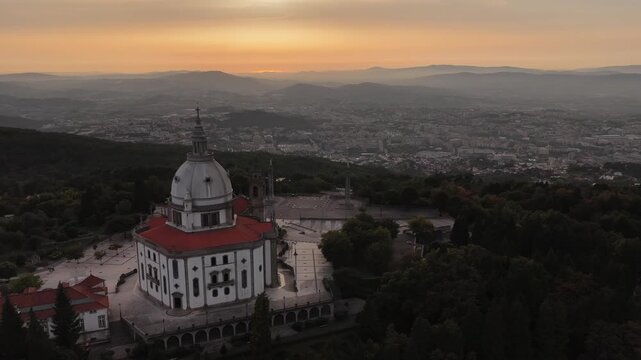 Sameiro Sanctuary fly by revealing Braga city on the north part with sunset colors