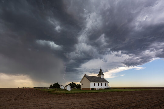 Lightning Strike near the Berea Evangelical Lutheran Church, a small church under a dark threatening sky. 