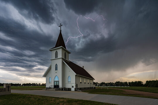 Lightning Strike near the Berea Evangelical Lutheran Church, a small church under a dark threatening sky. 