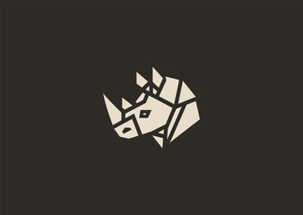 A strong geometric rhinoceros logo formed with sharp polygonal contours and structured line blocks, symbolizing power, protection, and resilience in a clean minimalist vector style
