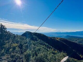  Bright sun shining on panoramic mountain landscape view from Rocacorba