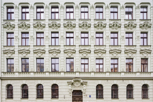 Albert Street, apartment buildings along the street designed by the architect Mikhail Eisenstein, a four storey building with decorative stonework over the windows and door. 