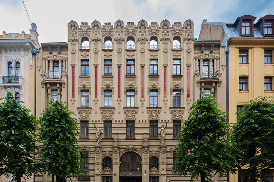 Albert Street, apartment buildings along the street designed by the architect Mikhail Eisenstein, a facade with red panels and decorative stonework. 