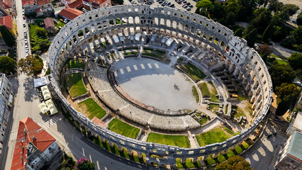 Aerial Drone View of Pula, Croatia on a Bright Sunny Day. Stunning coastal cityscape, historic architecture, turquoise Adriatic Sea and vibrant Mediterranean landscapes captured from above