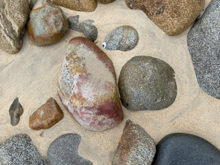 Granite Rocks on the Beach, smoothed by water and sand erosion. 