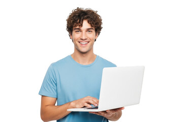 Smiling young man with curly hair enthusiastically typing on a white laptop against a solid black background