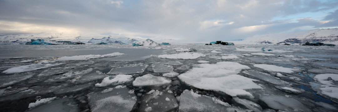 Calved Ice blocks and floes in the Jökulsárlón Glacier Lagoon created by water from the receding glacier in Vatnajökull National park 