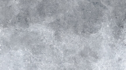 Dark grey stone surface with rough textured patterns creating a natural abstract rock background.