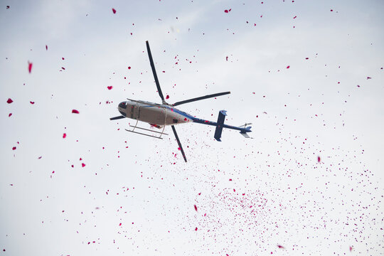 A Helicopter Drops Rose Petals at the Sangam During the Shivrati Holy Bath, the festival of Maha Shivratri. 