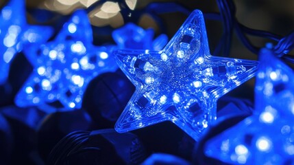 A close-up of blue lights and star decorations, evoking a festive atmosphere.