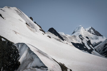 Snow-covered Mt. Breithorn on border of Italy and Switzerland on a clear alpine day, showcasing dramatic peaks, glaciers and panoramic views of the Swiss Alps