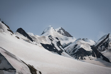 Snow-covered Mt. Breithorn on a clear alpine day, showcasing dramatic peaks, glaciers and panoramic views of the Swiss Alps