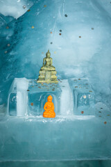 Ice statue of Gautam Buddha inside a glacial tunnel at Matterhorn Glacier Paradise, Zermatt, surrounded by shimmering ice and alpine atmosphere.