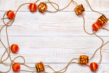 Festive Christmas Decor With Red Ornaments And Gold Gift Boxes On White Wooden Background