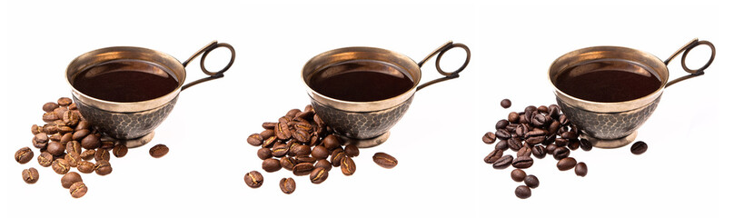 Pile of coffee beans beside cups with black coffee